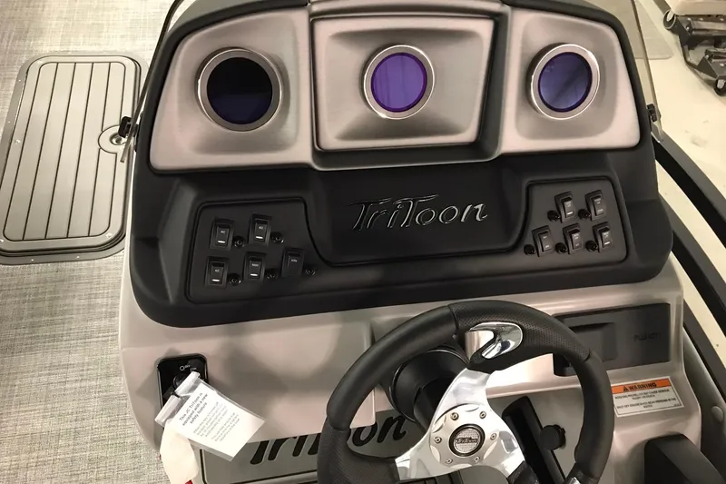 Slide: The Image of Dashboard of 2026 JC NEPTOON SPORT 21TT boat with steering wheel and control panel. - 29