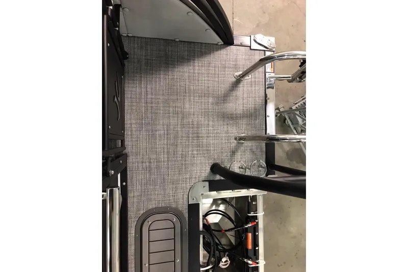Slide: The Image of 2026 JC NEPTOON SPORT 21TT boat interior with gray flooring and metal fixtures. - 33