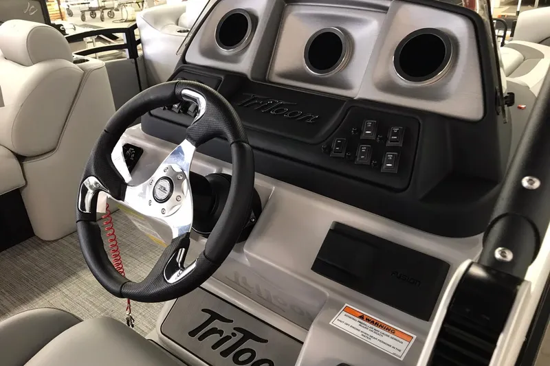 Slide: The Image of 2026 JC NEPTOON SPORT 21TT boat dashboard with steering wheel and control panel. - 4