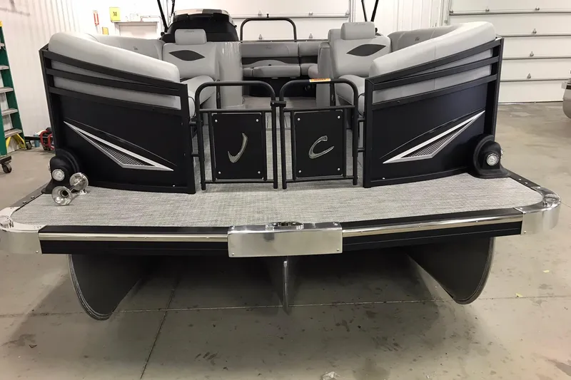 Slide: The Image of 2026 JC NEPTOON SPORT 21TT pontoon boat in a garage, rear view. - 7