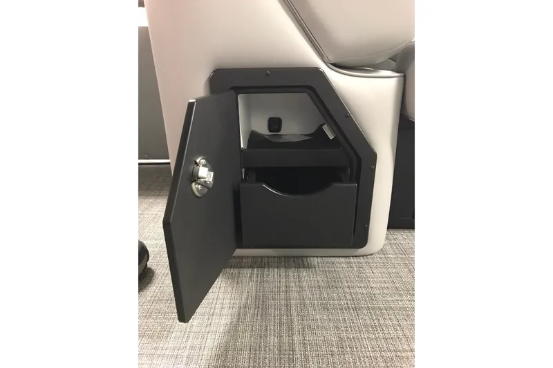 Slide: The Image of 2026 JC NEPTOON SPORT 21TT storage compartment with open door on carpeted floor. - 18