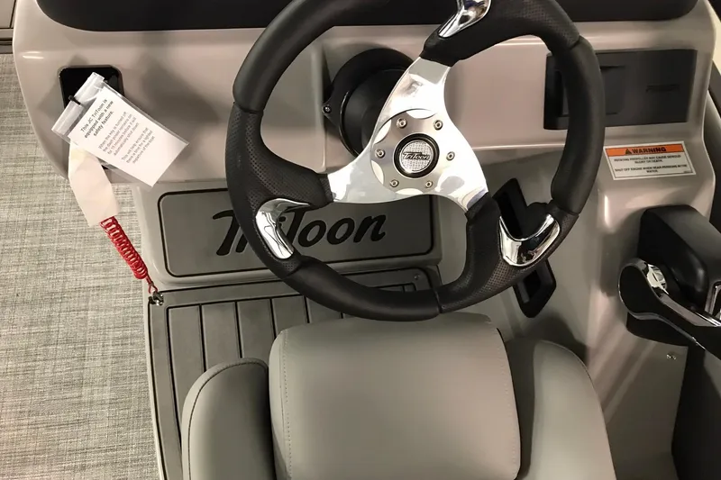 Slide: The Image of Steering wheel of 2026 JC NEPTOON SPORT 21TT boat with modern design and controls. - 30