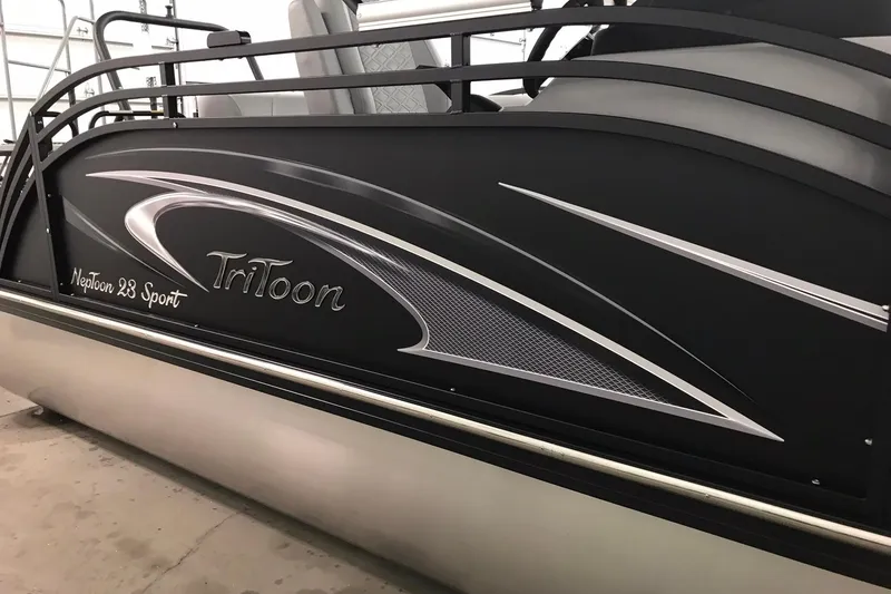 Slide: The Image of 2026 JC NEPTOON SPORT 21TT pontoon boat with sleek black design and TriToon branding. - 38