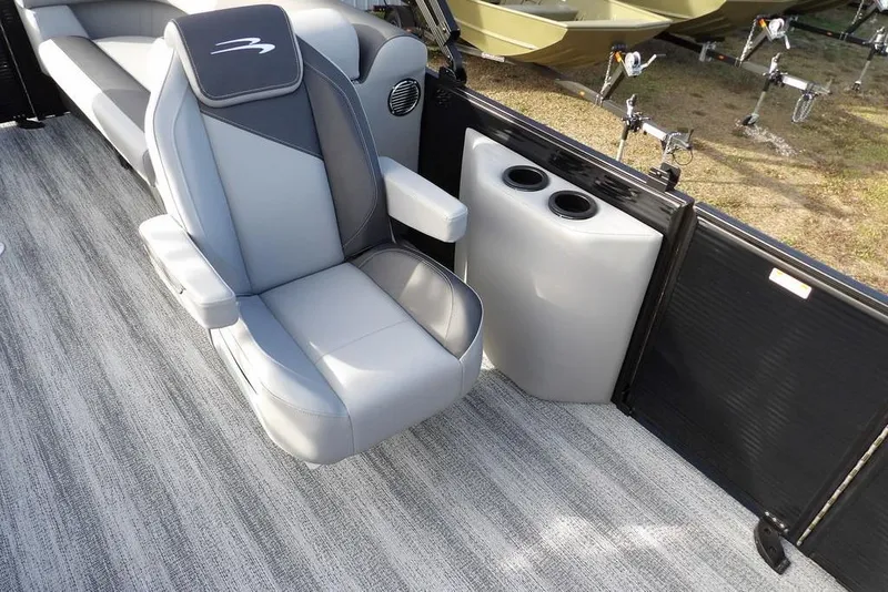 Slide: The Image of 2026 Bennington S 22 SSR boat interior with gray seating and cup holders. - 11