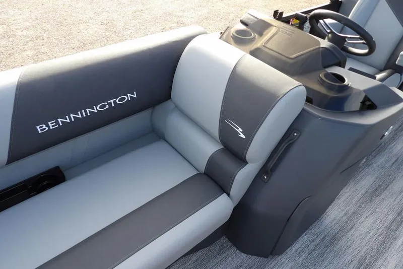 Slide: The Image of 2026 Bennington S 22 SSR boat interior with gray seating and steering console. - 12