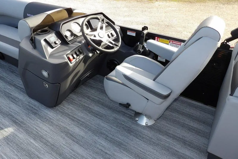 Slide: The Image of 2026 Bennington S 22 SSR boat interior with steering console and captain's chair. - 16