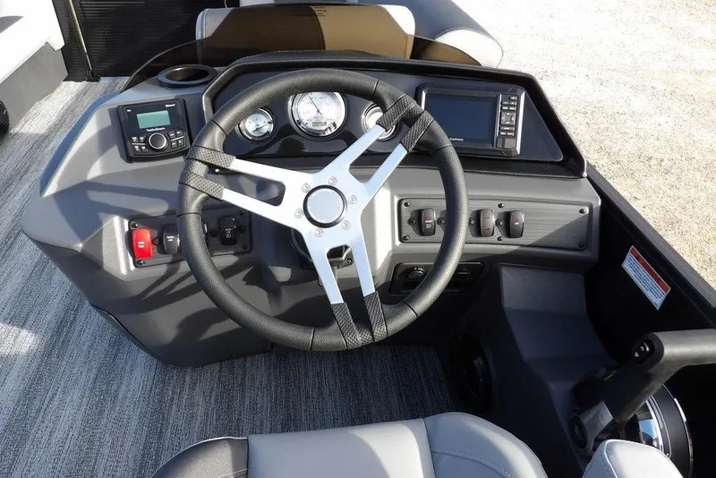 Slide: The Image of Steering console of 2026 Bennington S 22 SSR boat with modern controls and gauges. - 21