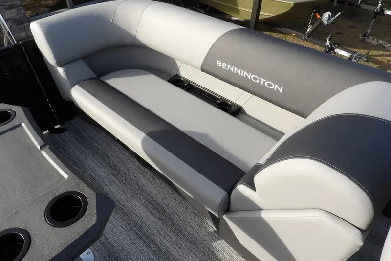 Slide: The Image of 2026 Bennington S 22 SSR boat interior with plush seating and cup holders. - 27