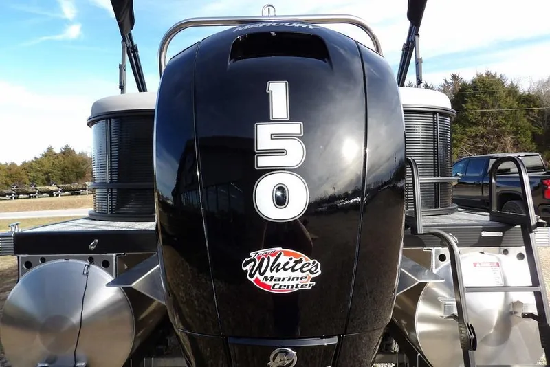 Slide: The Image of 2026 Bennington S 22 SSR boat with Mercury 150 engine, outdoors. - 32