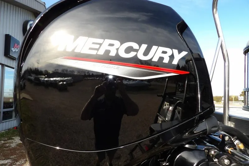 Slide: The Image of Mercury outboard engine on 2026 Bennington S 22 SSR boat, reflecting sunlight. - 33