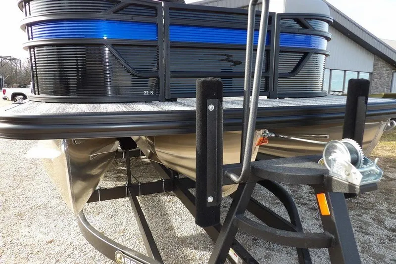 Slide: The Image of 2026 Bennington S 22 SSR pontoon boat on trailer, close-up view. - 36