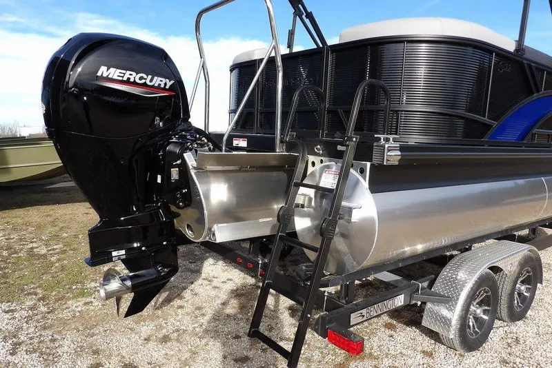 Slide: The Image of 2026 Bennington S 22 SSR pontoon boat with Mercury outboard motor on trailer. - 37