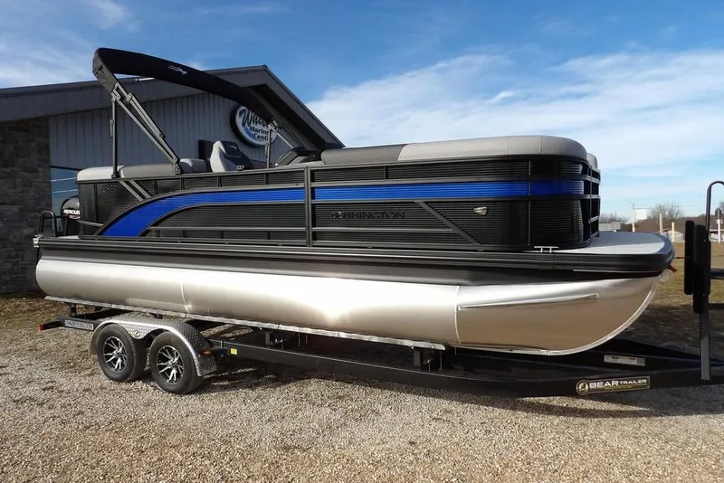 Slide: The Image of 2026 Bennington S 22 SSR pontoon boat on trailer, parked outdoors. - 41