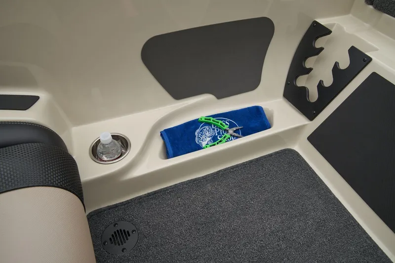Slide: The Image of Manufacturer Provided Image: Interior of 2026 Ranger Z185 boat with storage, cup holder, and carpeted flooring. - 47