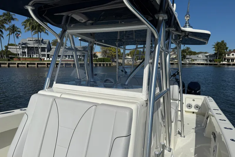 Slide: The Image of 2018 SeaVee 390Z boat on water, featuring sleek design and modern architecture. - 11