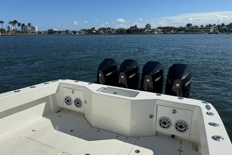 Slide: The Image of 2018 SeaVee 390Z boat with four Mercury engines on a sunny day. - 23