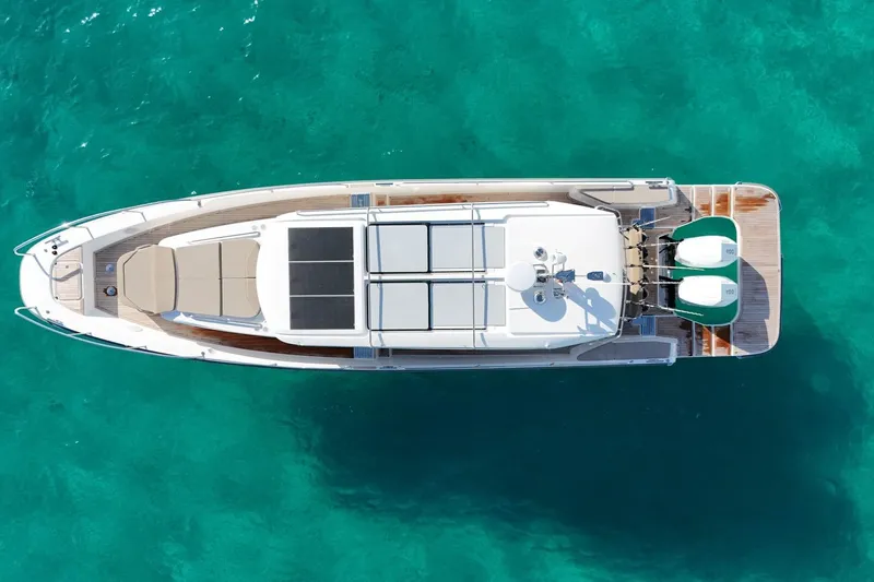 Slide: The Image of Nimbus Commuter 11 2025 on turquoise water, aerial view. - 4