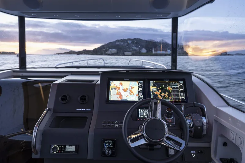 Slide: The Image of Interior view of Nimbus Commuter 11 boat, 2025 model, at sunset. - 5