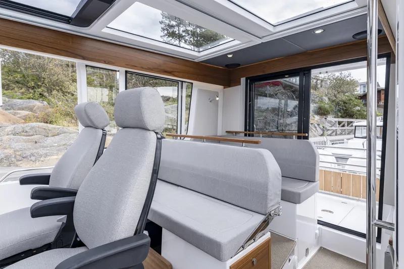 Slide: The Image of Interior of Nimbus Commuter 11 boat, 2025 model, featuring modern seating. - 8