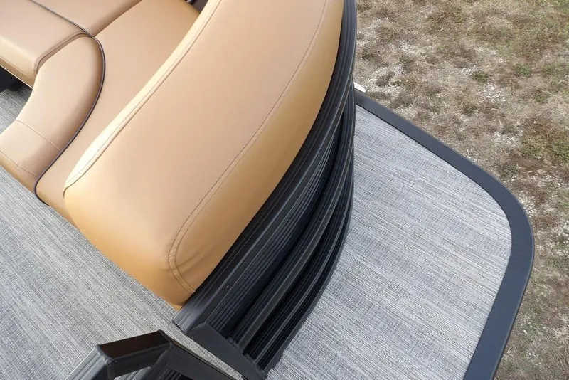 Slide: The Image of 2026 Bennington 22 MFB boat interior with tan seating and gray flooring. - 11