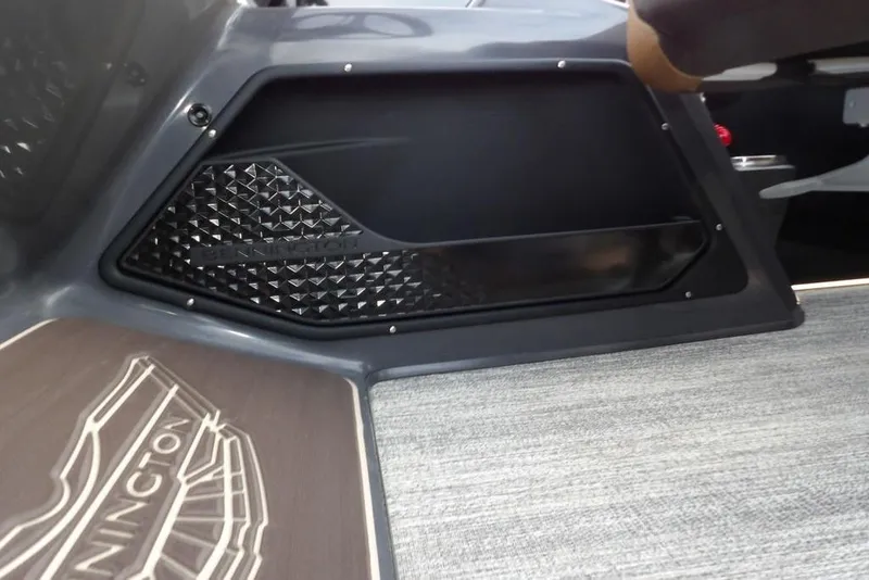 Slide: The Image of Interior view of 2026 Bennington 22 MFB boat, featuring sleek design and textured paneling. - 24