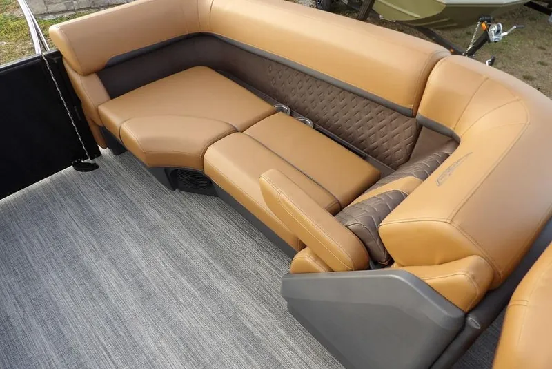 Slide: The Image of Luxurious tan seating on 2026 Bennington 22 MFB boat, featuring quilted accents and cup holders. - 30