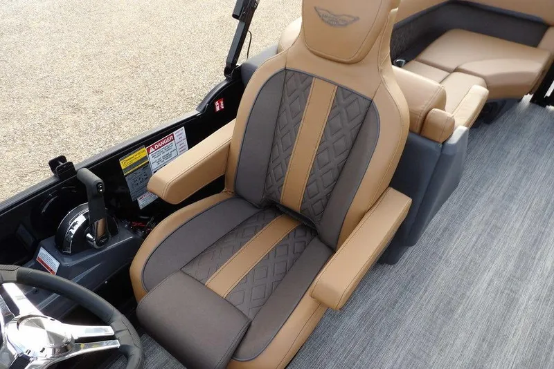 Slide: The Image of 2026 Bennington 22 MFB boat interior with luxurious tan and gray seating. - 34