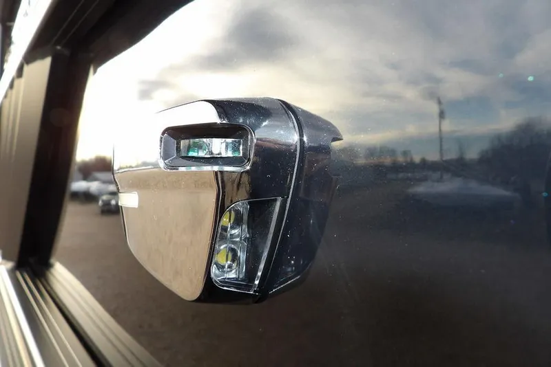 Slide: The Image of Close-up of a 2026 Bennington 22 MFB boat's sleek chrome side mirror. - 43