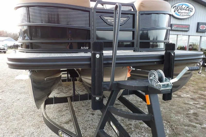 Slide: The Image of 2026 Bennington 22 MFB pontoon boat on trailer at marine center. - 47