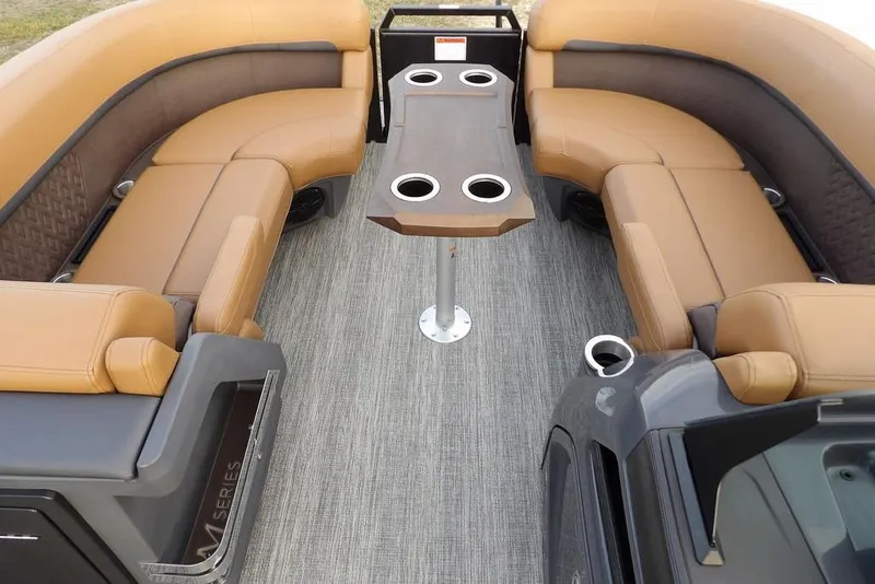 Slide: The Image of Luxurious seating area on 2026 Bennington 22 MFB pontoon boat with table and cup holders. - 9
