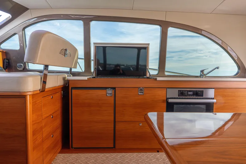 Slide: The Image of Luxurious interior of 2016 Palm Beach Motor Yachts PB50 with wood finish and modern amenities. - 24