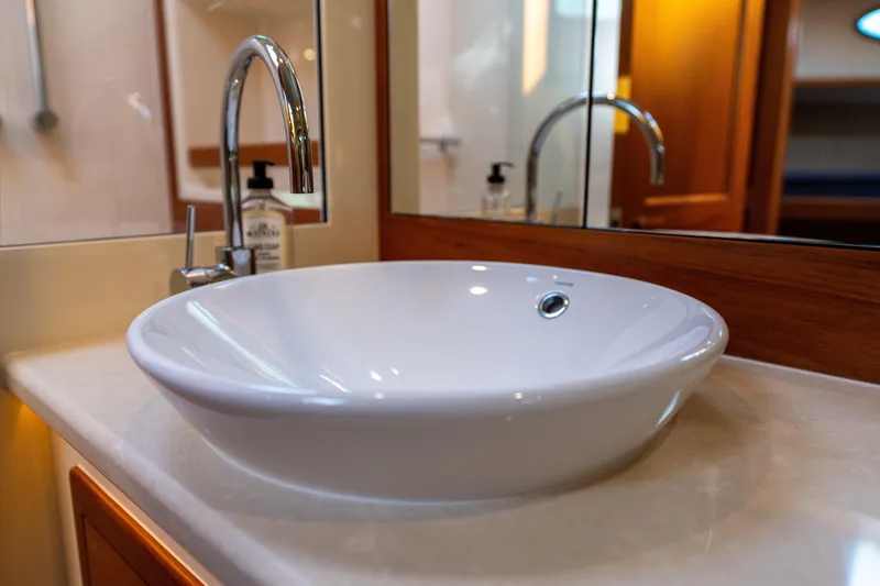 Slide: The Image of Luxurious bathroom sink in 2016 Palm Beach Motor Yachts PB50, featuring elegant design. - 25
