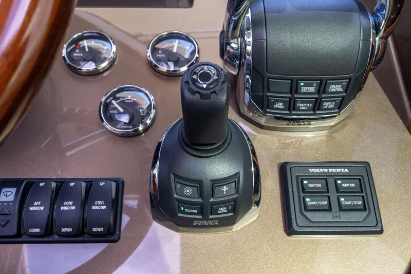 Slide: The Image of Control panel of 2016 Palm Beach Motor Yachts PB50 with Volvo Penta joystick and gauges. - 48