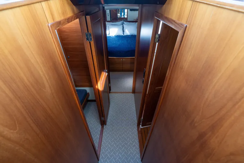 Slide: The Image of Luxurious wooden interior of 2016 Palm Beach Motor Yachts PB50 cabin hallway. - 54