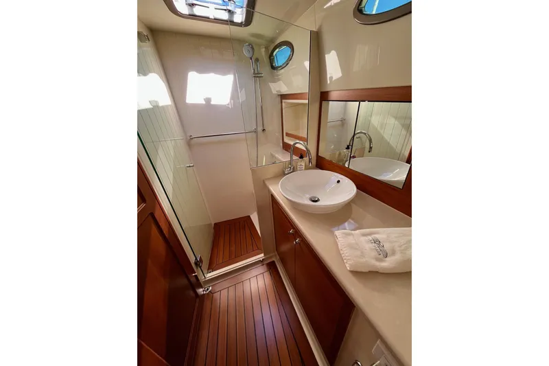 Slide: The Image of Luxurious bathroom in 2016 Palm Beach Motor Yachts PB50 with elegant wood flooring. - 59