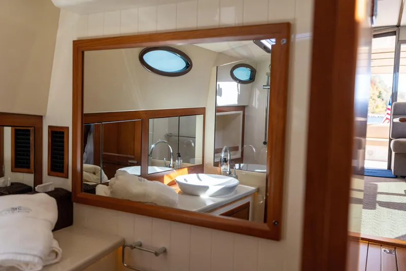 Slide: The Image of Luxurious bathroom interior of 2016 Palm Beach Motor Yachts PB50, featuring elegant wood accents. - 65