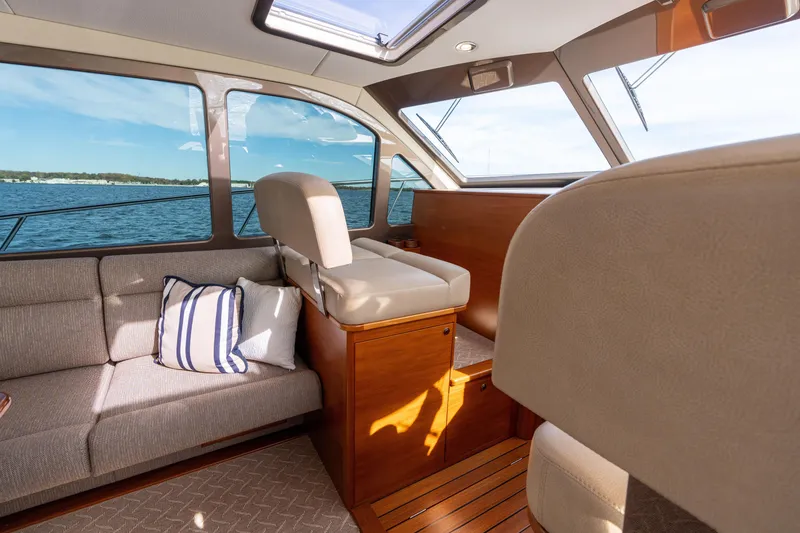 Slide: The Image of Luxurious interior of 2016 Palm Beach Motor Yachts PB50 with elegant seating and scenic water view. - 39