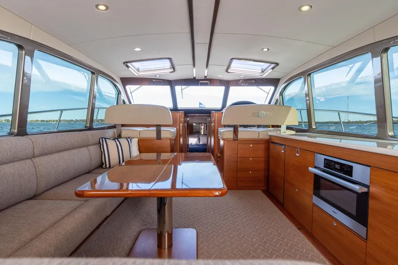 Slide: The Image of Luxurious interior of 2016 Palm Beach Motor Yachts PB50 with elegant seating and scenic views. - 40