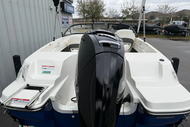 Slide: The Image of 2022 Bayliner 170 Bowrider with Mercury outboard engine, parked outdoors. - 7