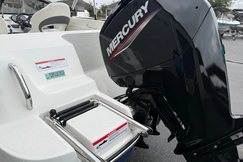 Slide: The Image of 2022 Bayliner 170 Bowrider with Mercury outboard motor, featuring a swim platform and ladder. - 9