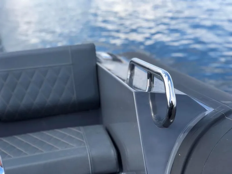 Slide: The Image of 2024 Northstar Orion 6 boat interior with quilted seats and chrome handrail. - 11