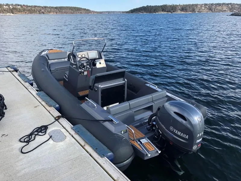 Slide: The Image of 2024 Northstar Orion 6 boat docked with Yamaha outboard motor. - 5