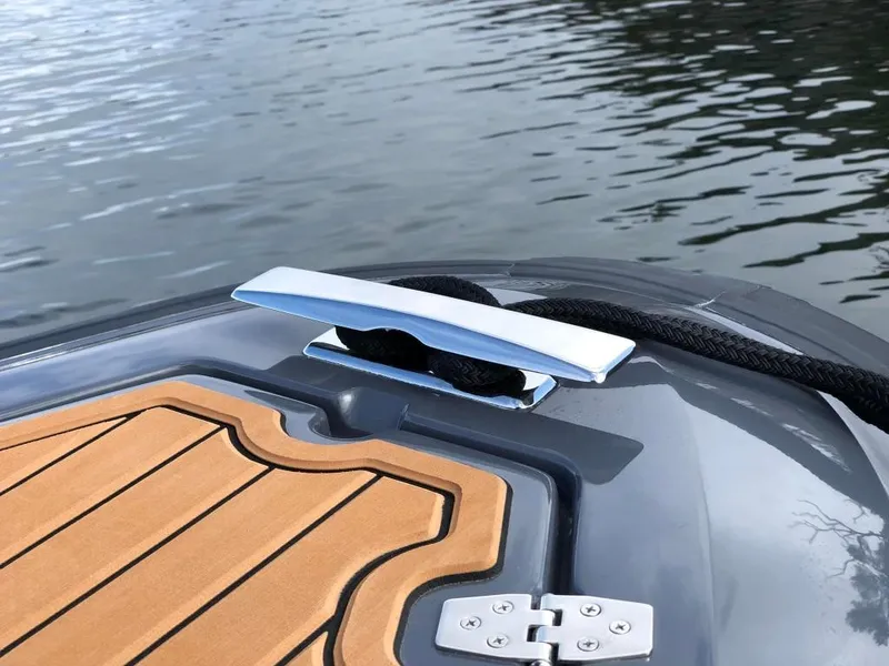 Slide: The Image of 2024 Northstar Orion 6 boat deck with cleat and wooden flooring. - 8