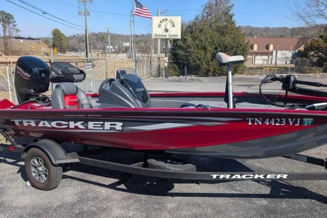 Slide: The Image of 2025 Tracker Pro Team 175 TXW Tournament Edition boat on trailer, outdoor center background. - 8