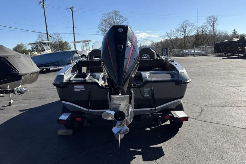 Slide: The Image of 2019 Nitro ZV19 boat with outboard motor in a parking lot. - 11