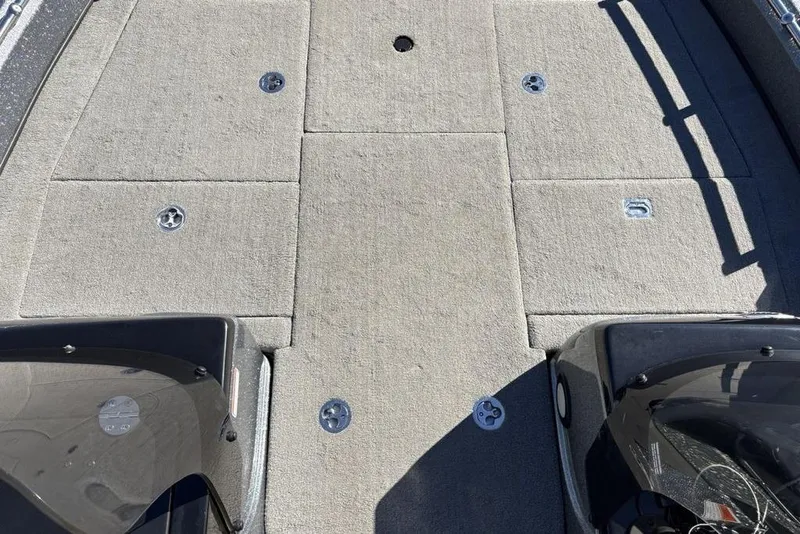 Slide: The Image of 2019 Nitro ZV19 boat deck with carpeted surface and storage compartments. - 13