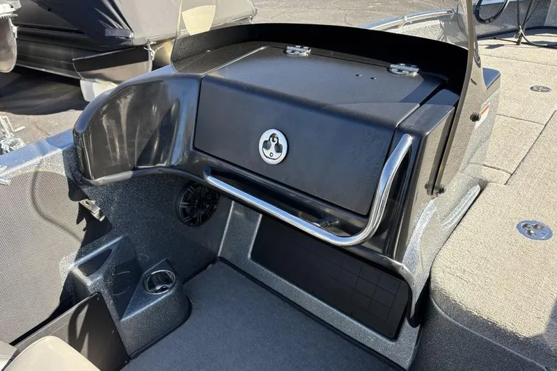 Slide: The Image of 2019 Nitro ZV19 boat dashboard with storage compartment and cup holder. - 21