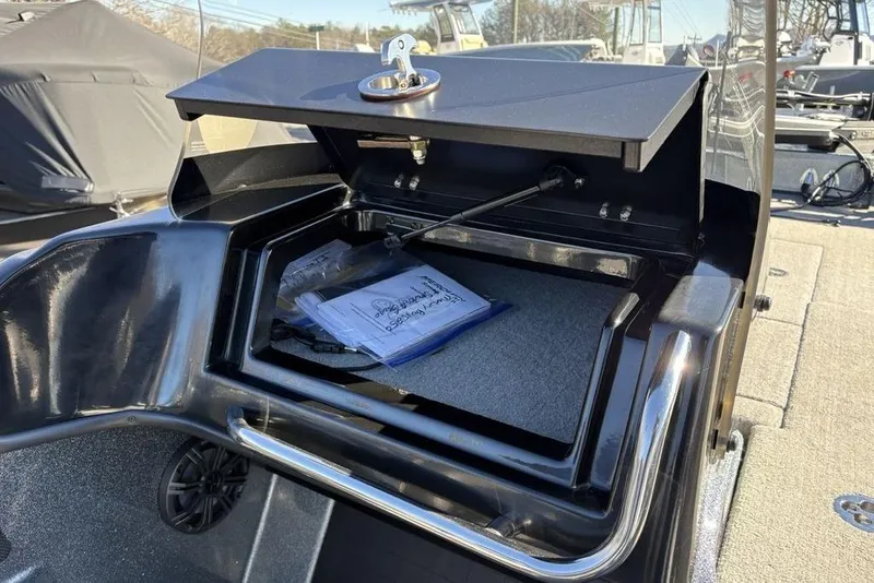 Slide: The Image of 2019 Nitro ZV19 boat storage compartment with documents inside. - 22