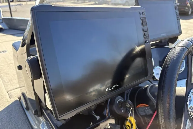 Slide: The Image of Garmin display on 2019 Nitro ZV19 boat dashboard, featuring steering wheel and controls. - 24