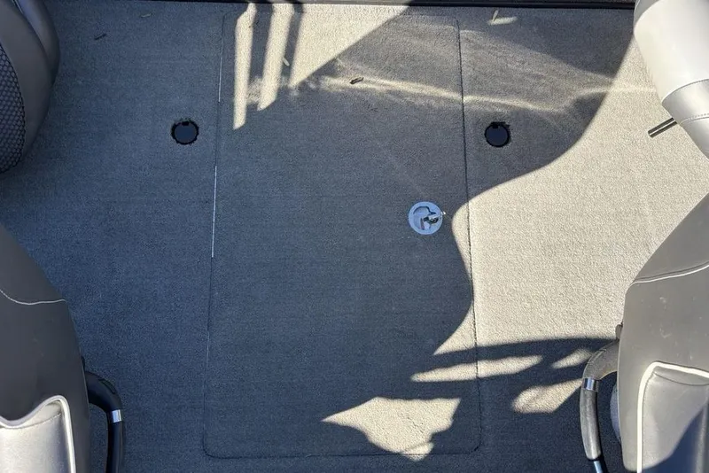 Slide: The Image of 2019 Nitro ZV19 boat interior with gray carpet and seating. - 28
